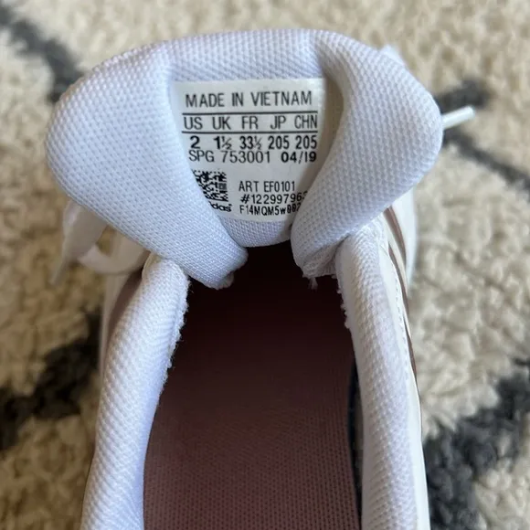 72. Adidas white with rose gold girl’s sneakers